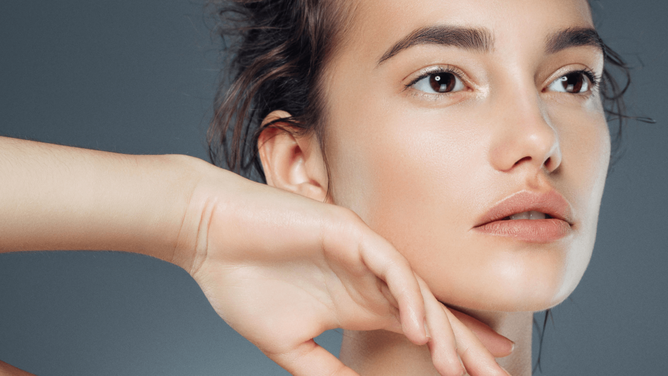 woman touching lower face